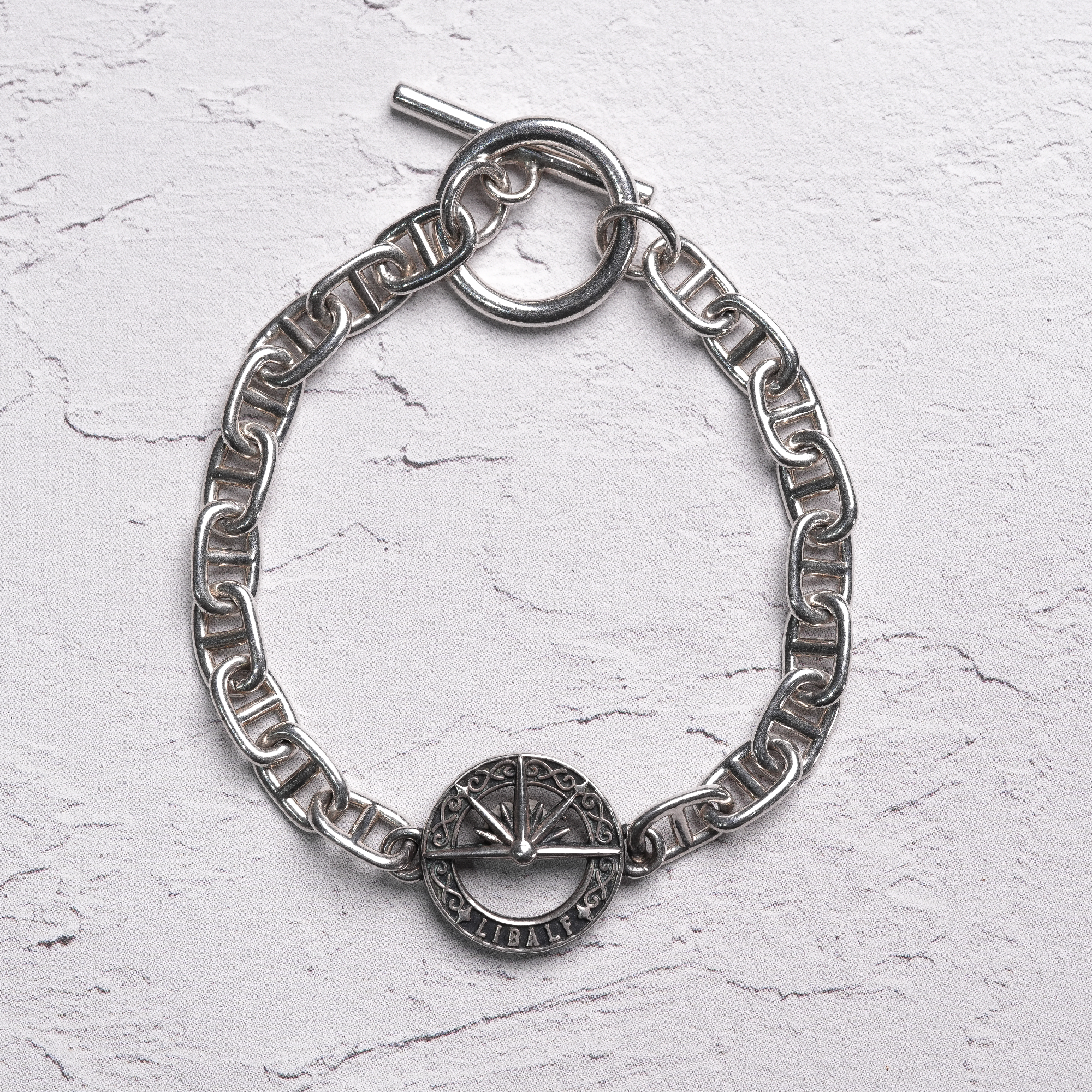 EMBLEMATIC SILVER BRACELET